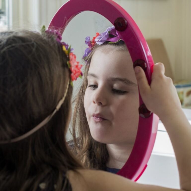 girl looking in mirror