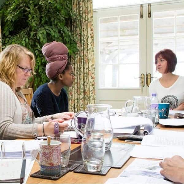 Dr Claire Maguire teaching students health & wellbeing tools plus life coaching skills to become certified coaches.